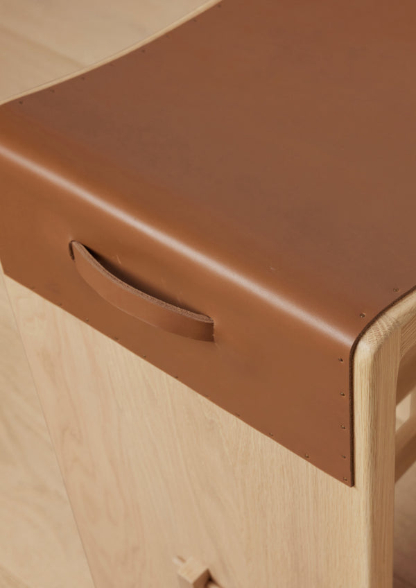Seat detail image of the Aya counter stool's leather seat. 