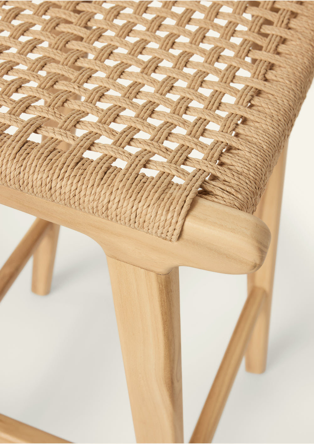 Close-up of the Bali Counter Stool highlighting the woven paper cord seat. The intricate weave showcases craftsmanship, texture, and the natural character of the material.