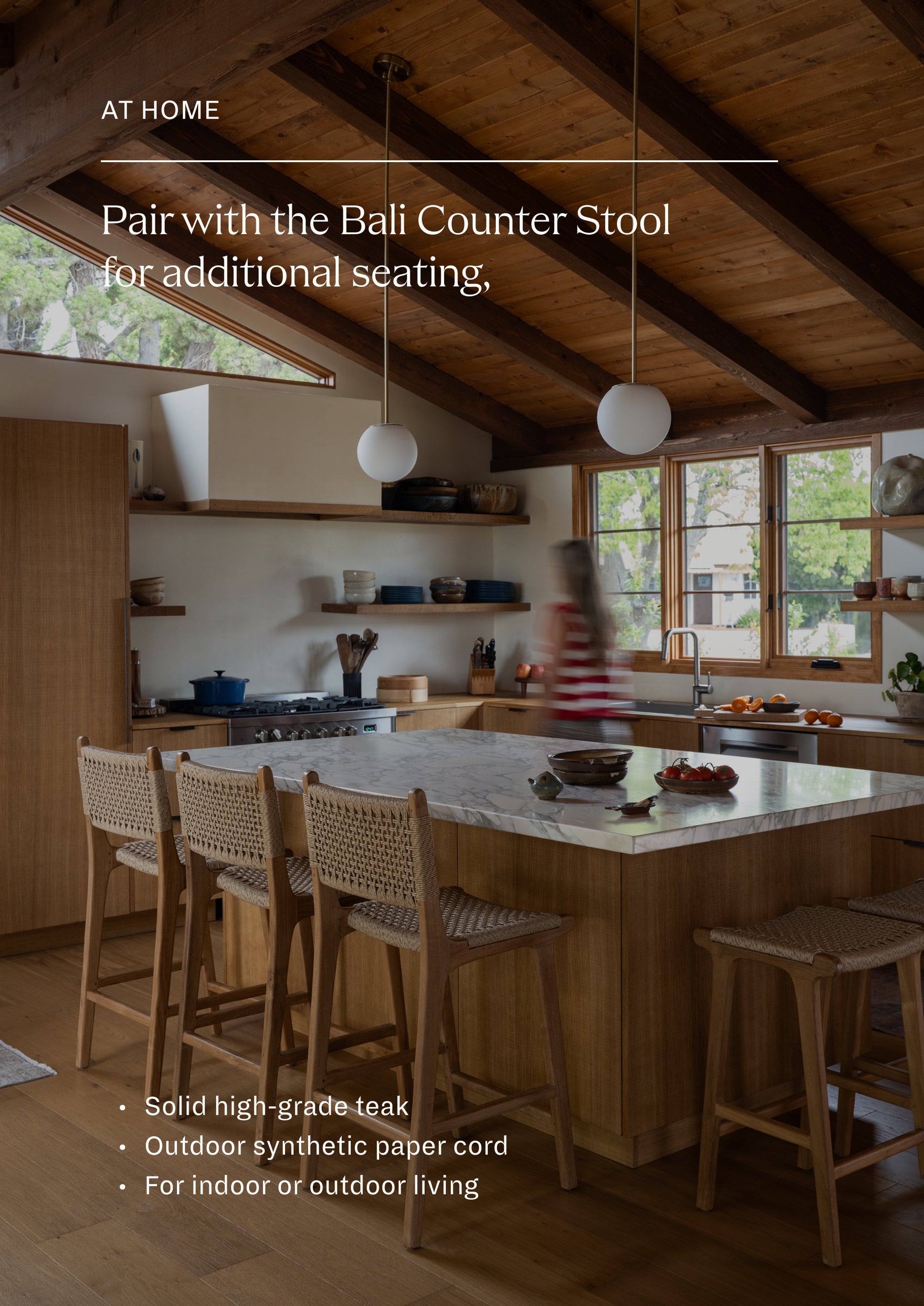 Pair with the Bali Counter Stool for additional seating. For indoor or outdoor living. A row of Bali Counter Stools gathered around a kitchen island. The woven seats and warm teak finish complement the natural wood cabinetry and relaxed indoor-outdoor design aesthetic.