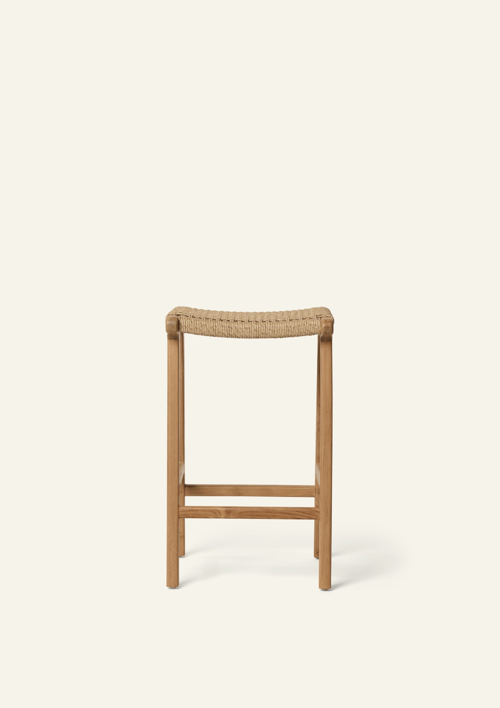 Front view of the Bali Counter Stool showcasing its minimalist teak frame, subtle joinery details, and woven synthetic paper cord seat designed for durability and everyday use.