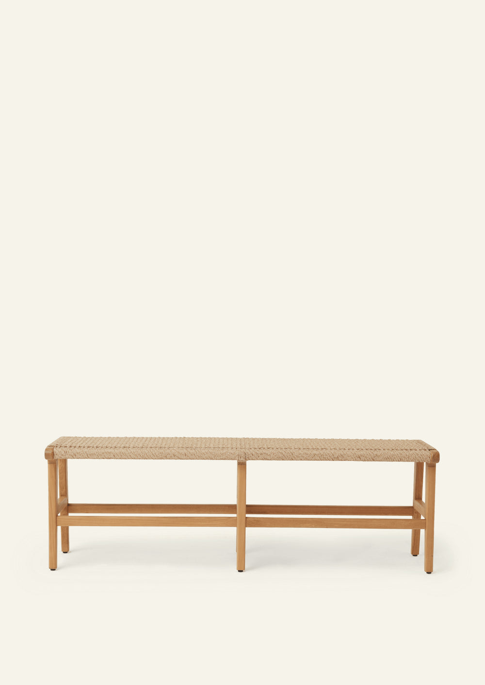 Wide view of the bench’s teak frame and woven synthetic paper cord seat. The image showcases the craftsmanship of the joinery, tapered leg profile, and durable woven surface.