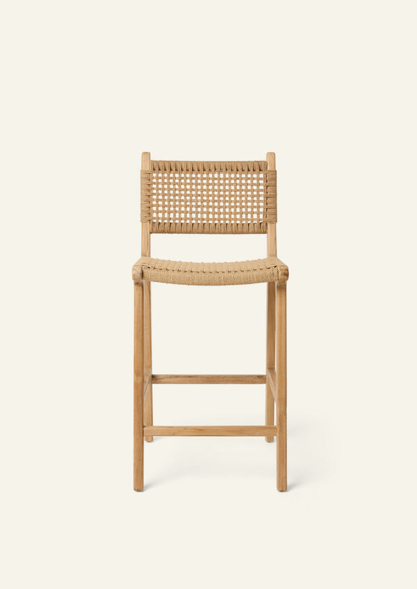 Front View of the Bali Counter Stool crafted from solid high-grade teak with a handwoven paper cord seat and back. The gently curved frame and woven texture create a relaxed silhouette suited for indoor and outdoor dining.