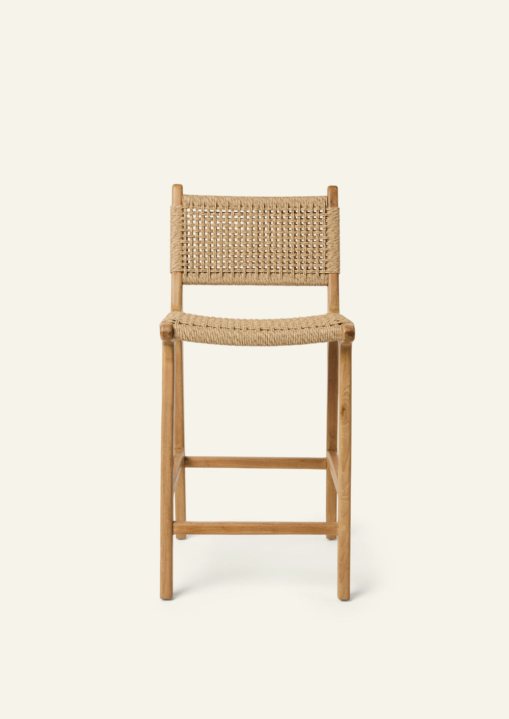 Front view of the Bali Counter Stool crafted from solid high-grade teak with a handwoven synthetic paper cord seat and back. The gently curved frame and woven texture create a relaxed silhouette suited for indoor and outdoor dining.