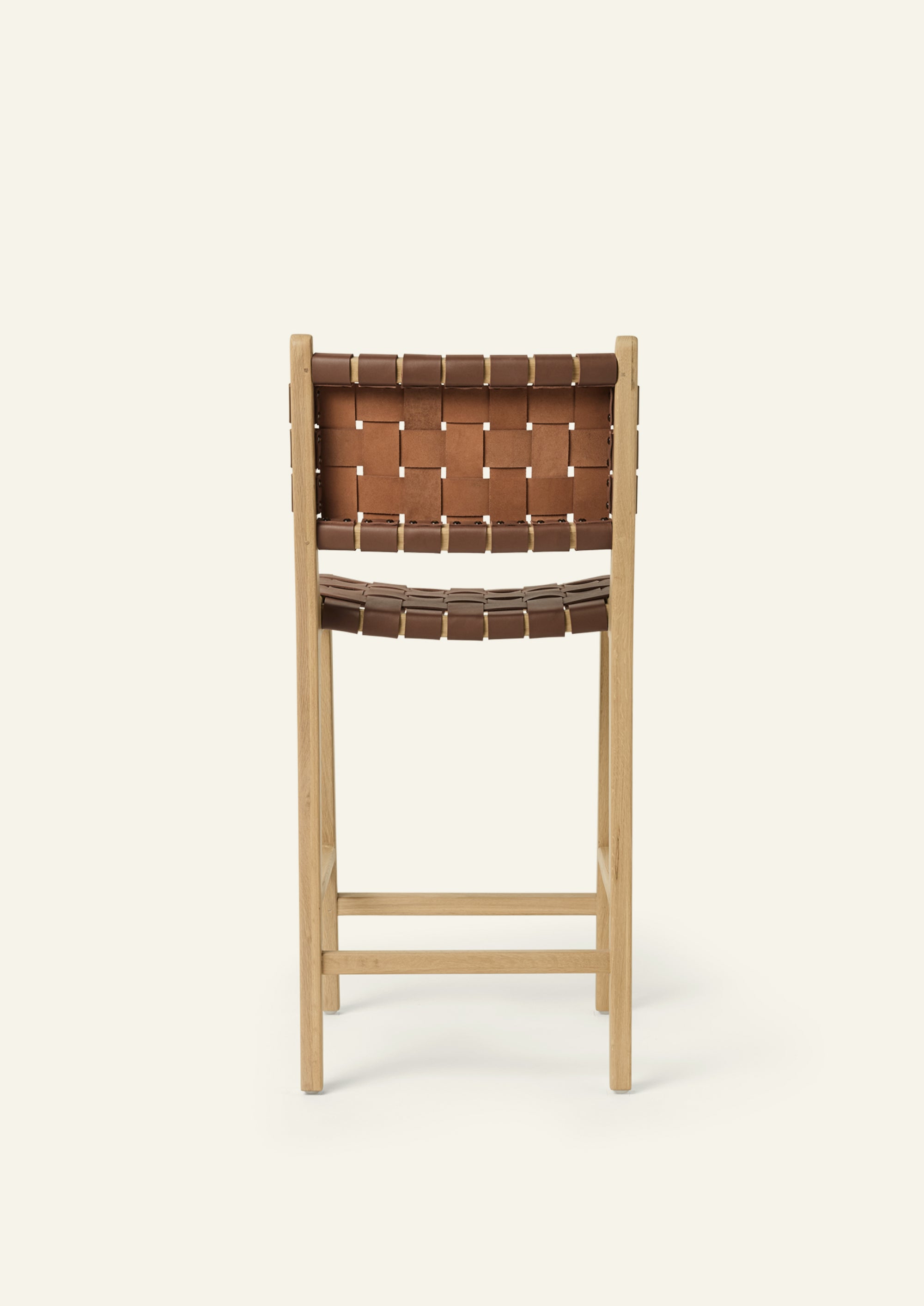 Back view of the Bali Counter Stool in solid white oak with handwoven whiskey leather.