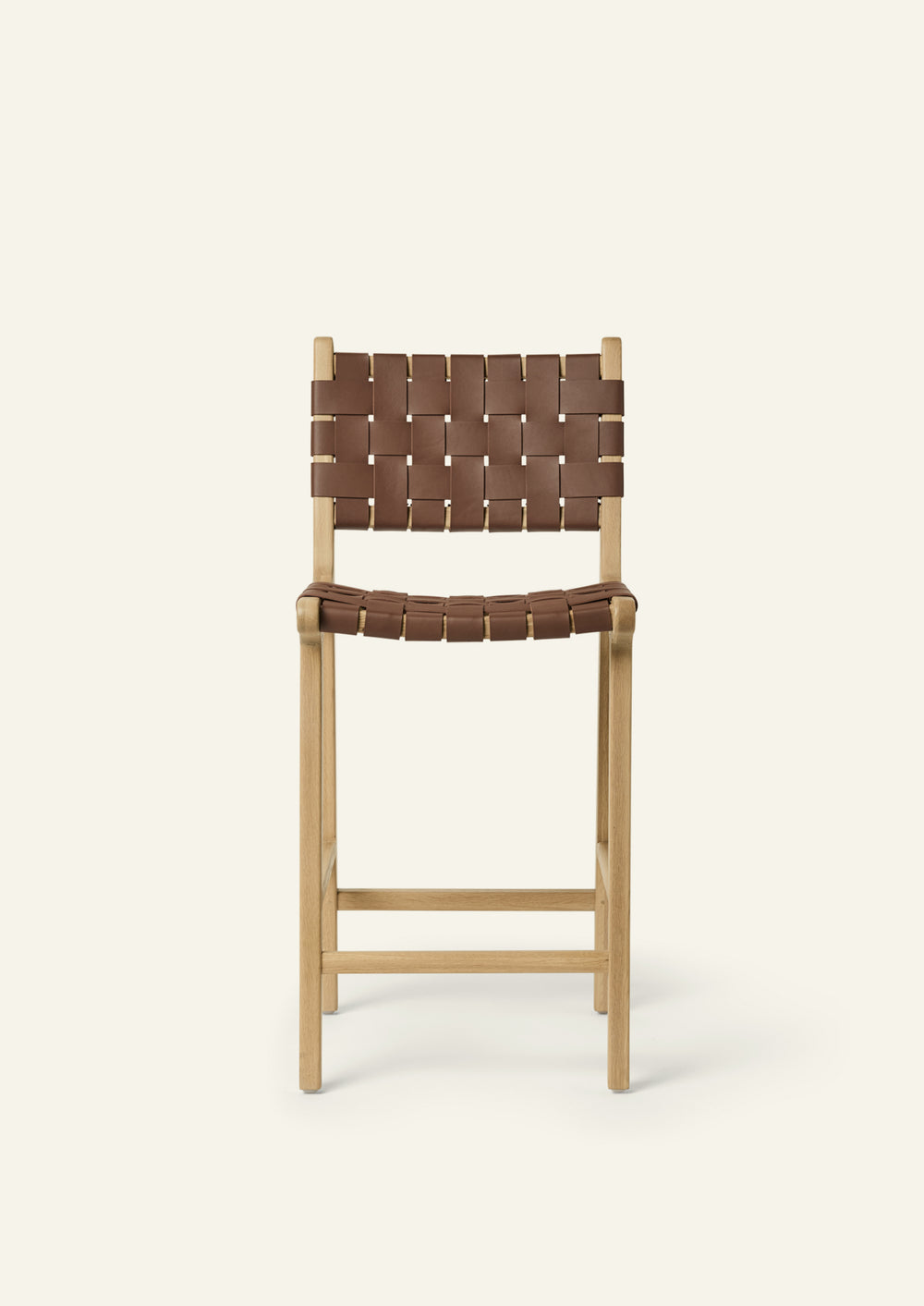 Front view of the Bali Counter Stool in solid white oak with handwoven whiskey leather.