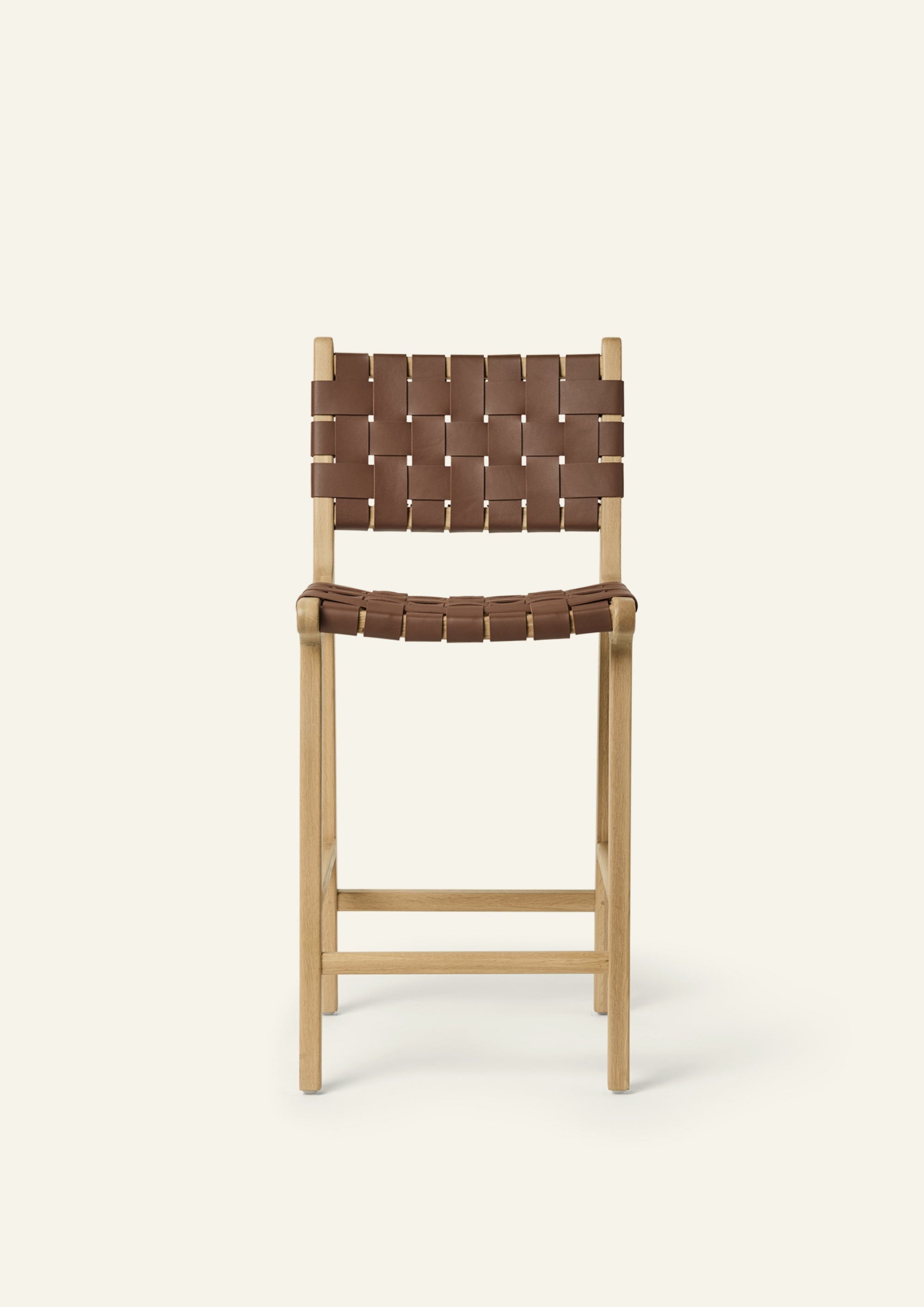 Front view of the Bali Counter Stool in solid white oak with handwoven whiskey leather.