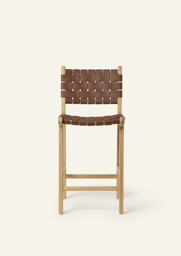 Front view of the Bali Counter Stool in solid white oak with handwoven whiskey leather.