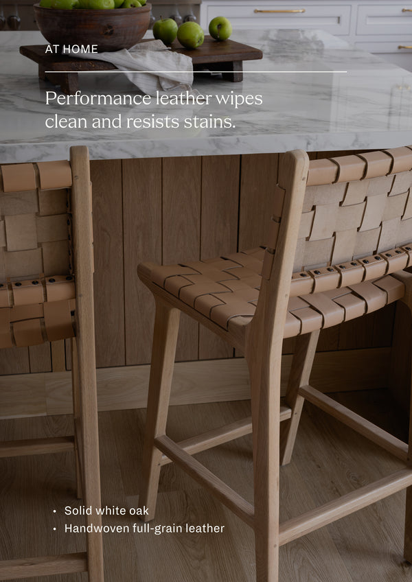 Performance leather wipes clean and resists stains. Solid white oak frame with handwoven full-grain leather seat and back.