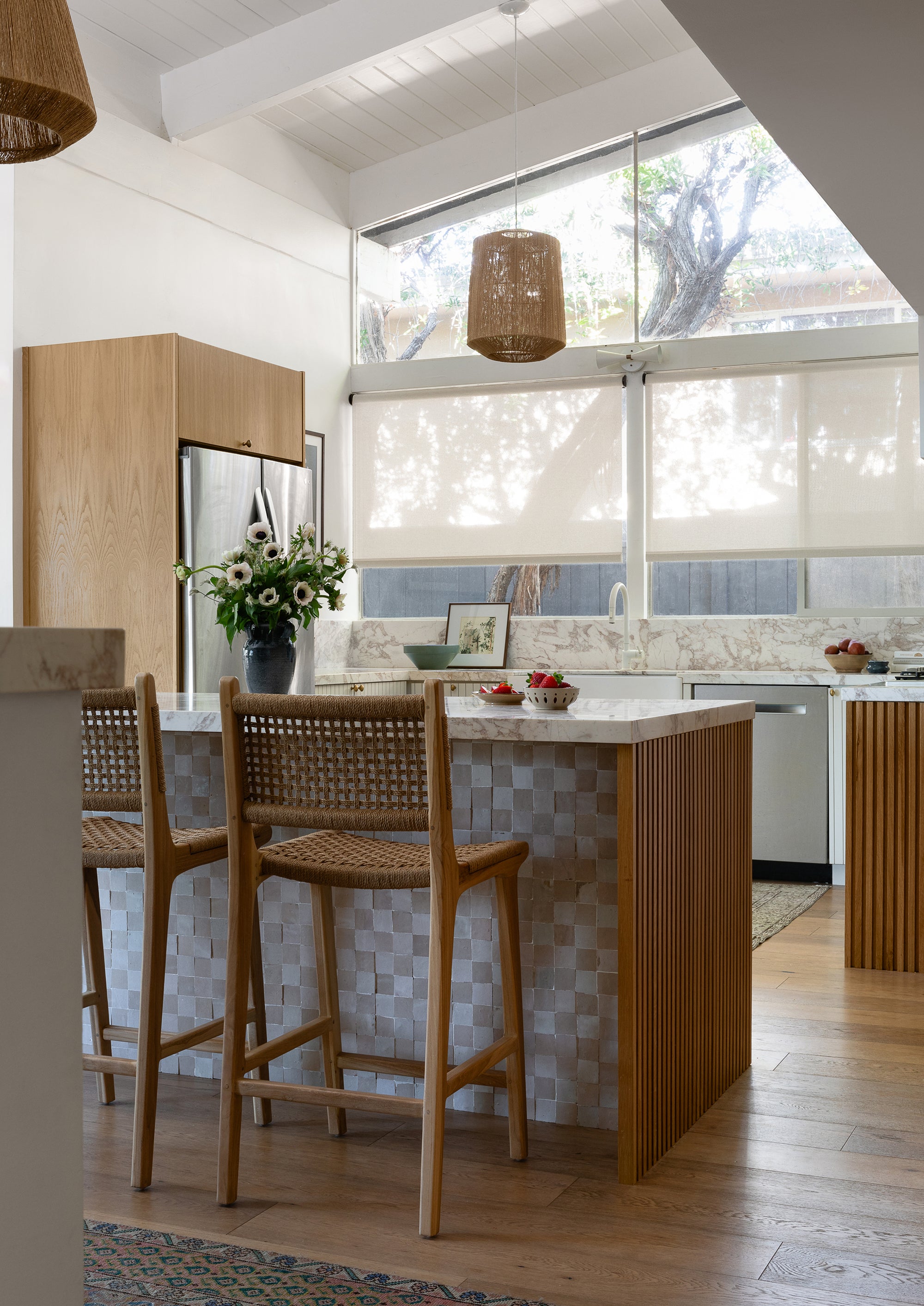 Bali Counter Stools in paper cord styled at an outdoor kitchen island, highlighting their weather-resistant craftsmanship and natural texture.
