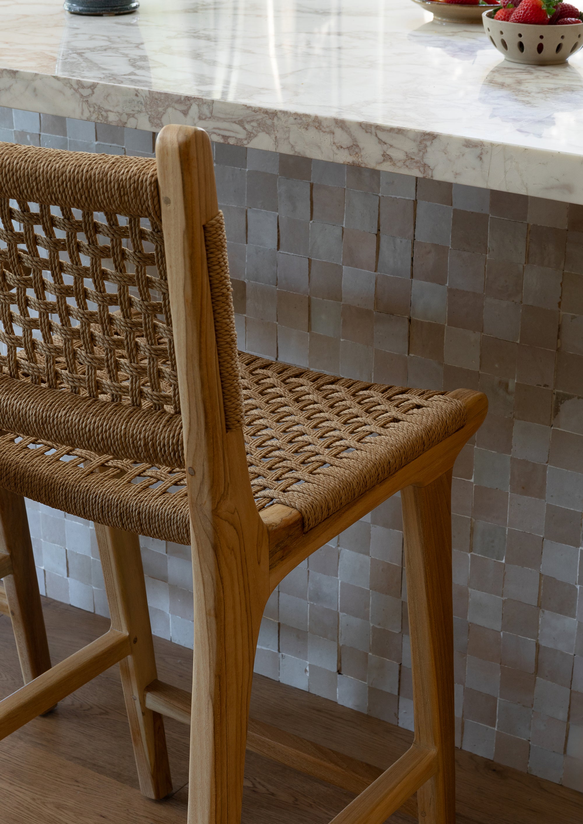 Bali Counter Stools in paper cord paired with a teak outdoor kitchen, bringing warmth, texture, and durability to outdoor entertaining spaces.