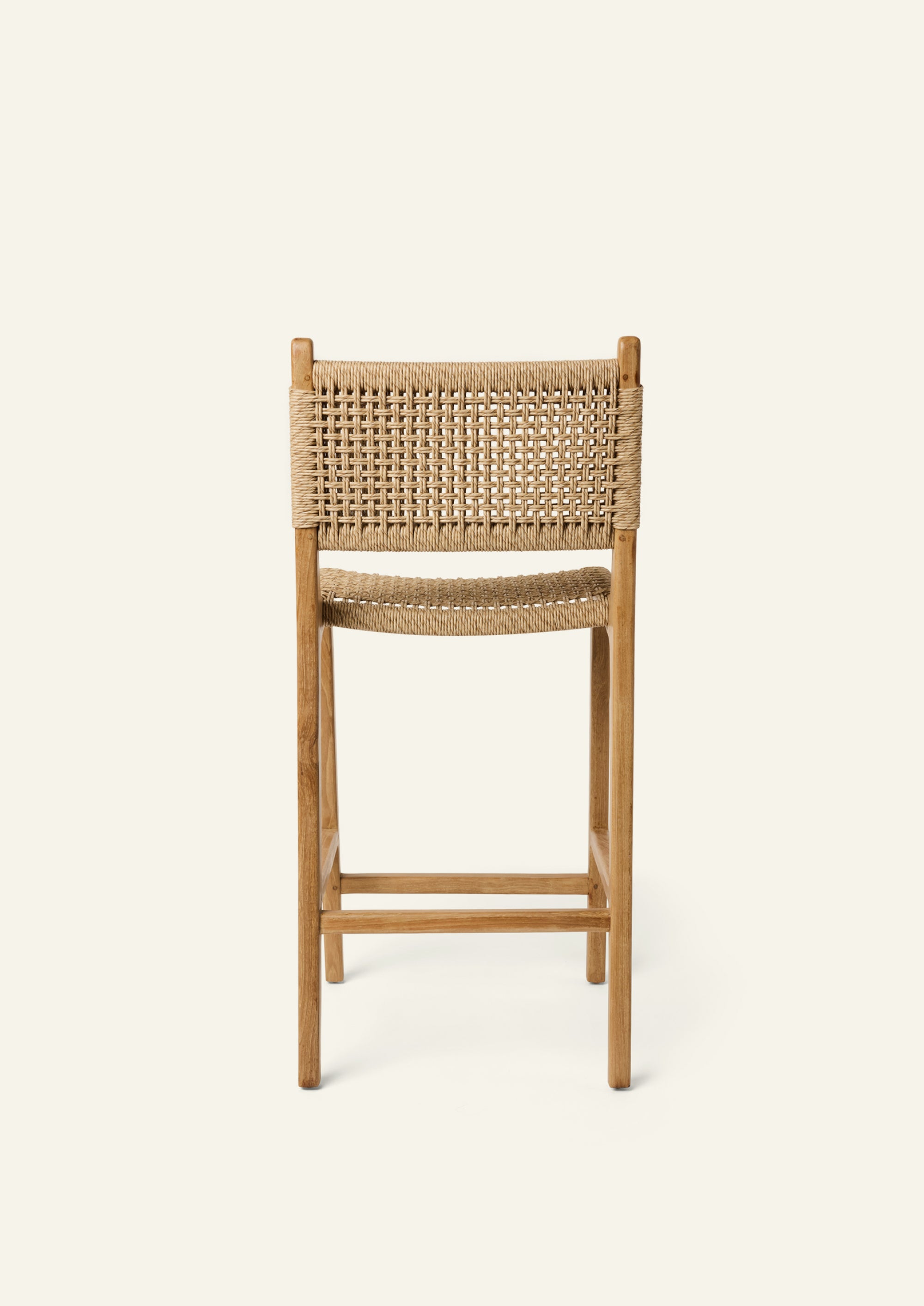 Bali Counter Stool featuring woven outdoor synthetic paper cord backrest and solid teak frame, rear view
