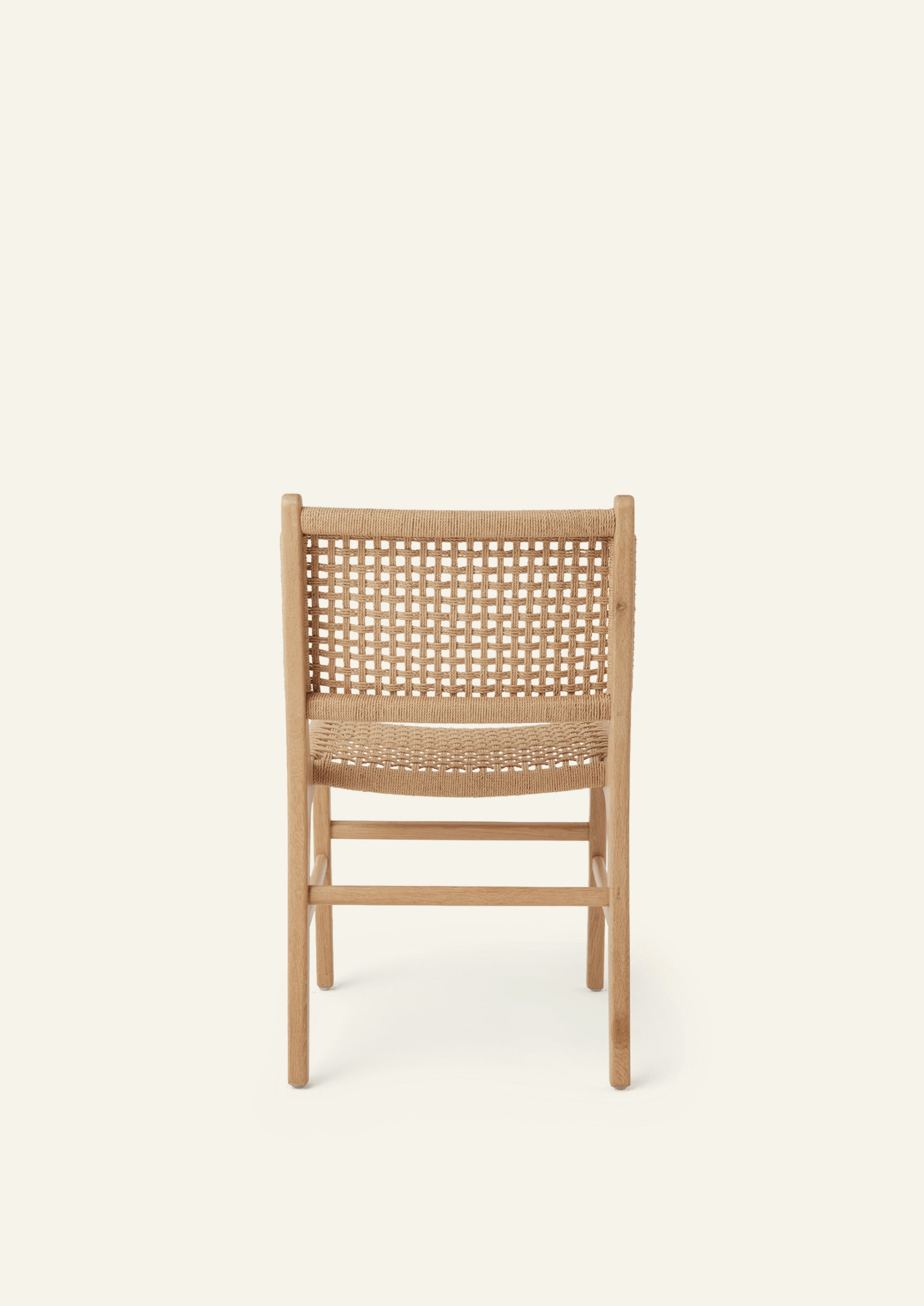 Back view of the Bali Dining Chair crafted from solid white oak with a handwoven paper cord seat and back.