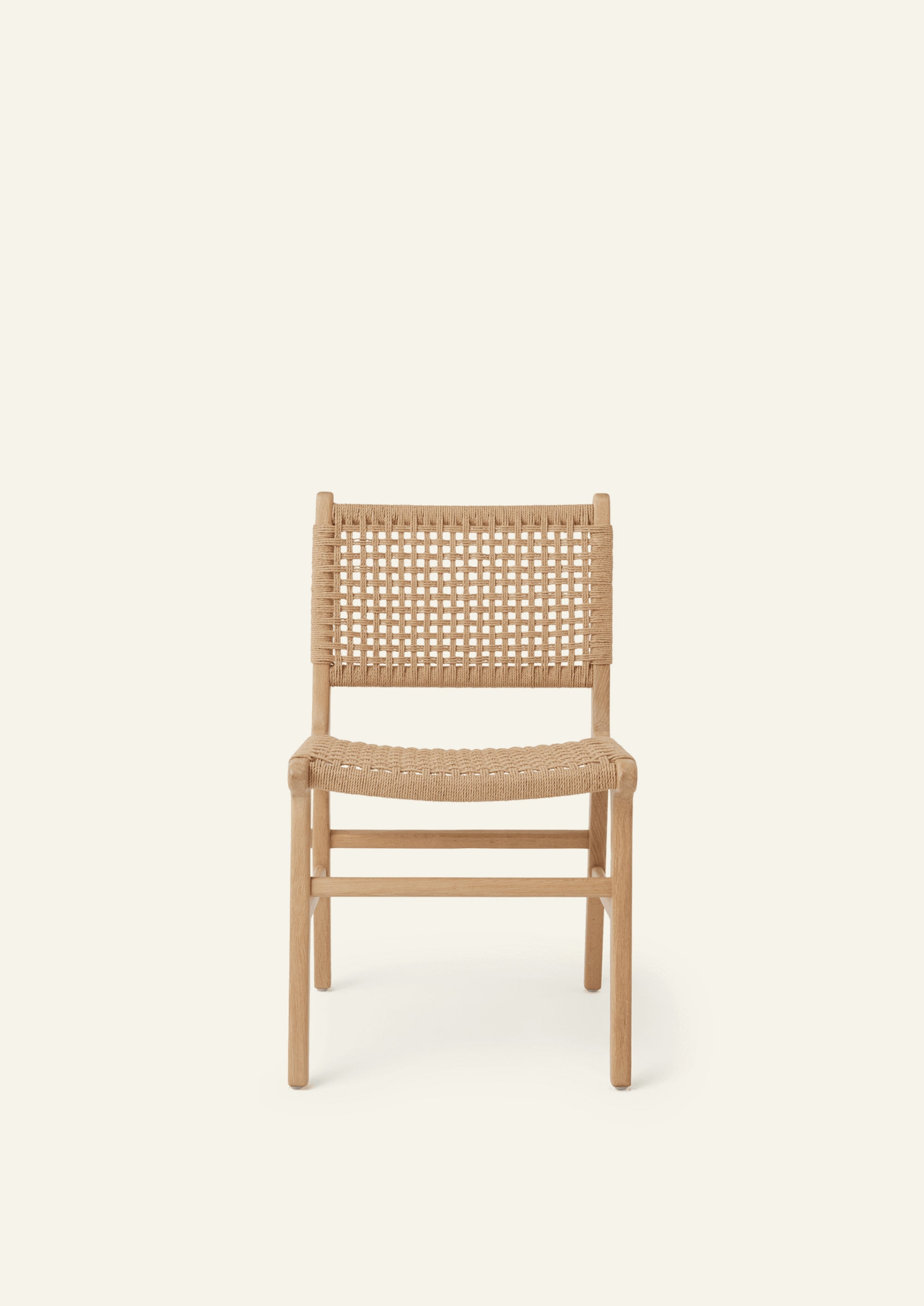 Front view of the Bali Dining Chair crafted from solid white oak with a handwoven paper cord seat and back.