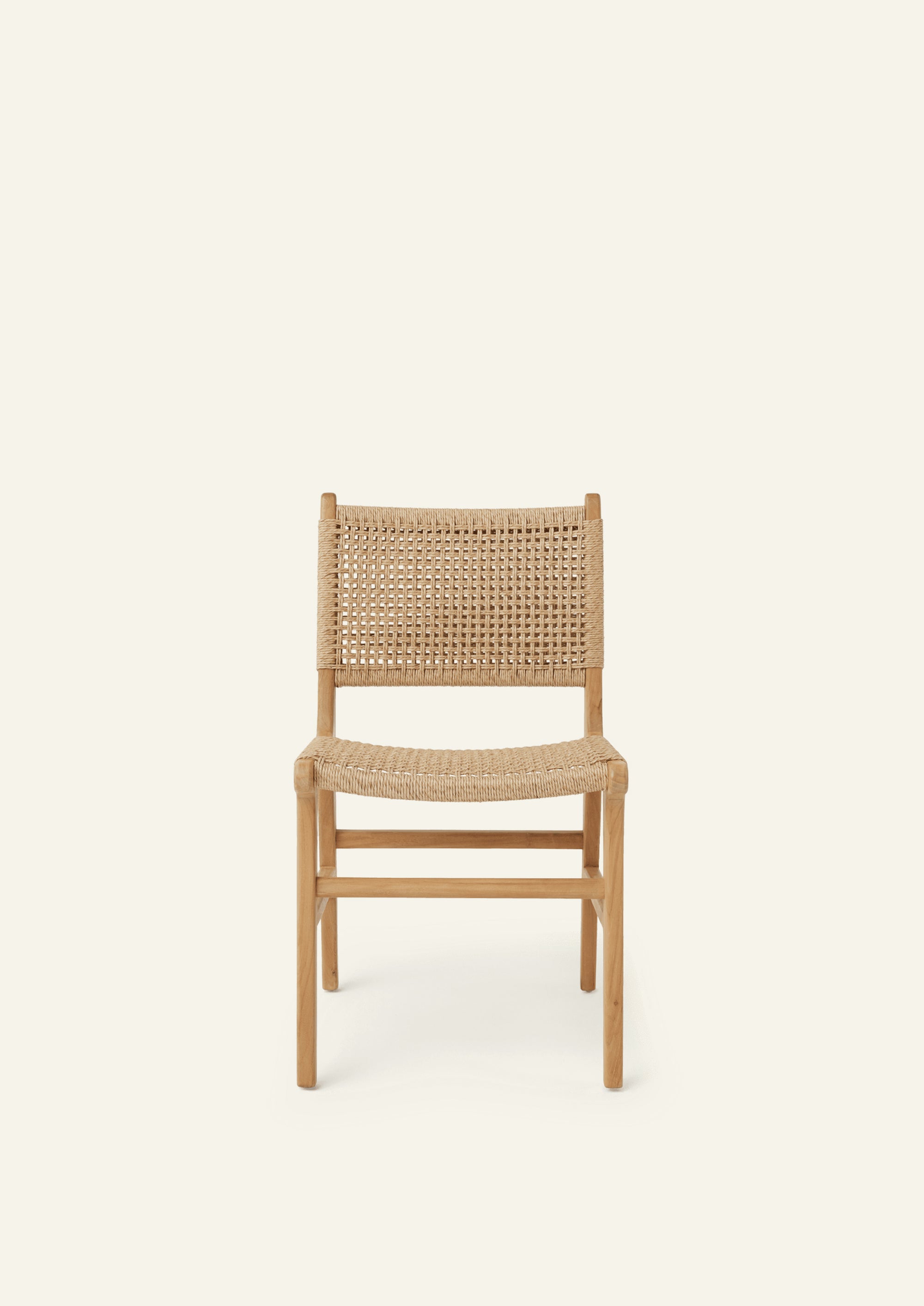 Front view of the Bali Dining Chair with a woven synthetic paper cord seat and back paired with a solid teak frame. The natural materials and clean lines create a timeless outdoor-inspired aesthetic.
