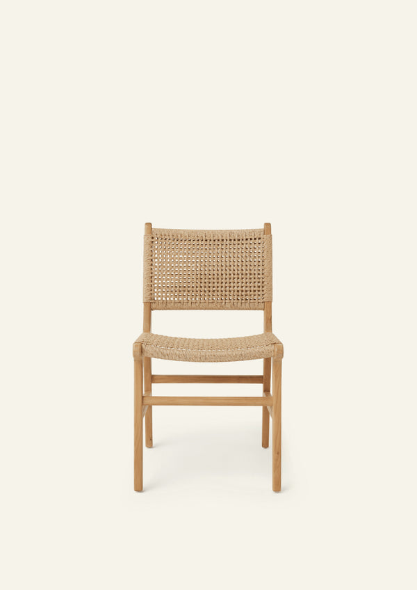 Front view of the Bali Dining Chair with a woven synthetic paper cord seat and back paired with a solid teak frame. The natural materials and clean lines create a timeless outdoor-inspired aesthetic.