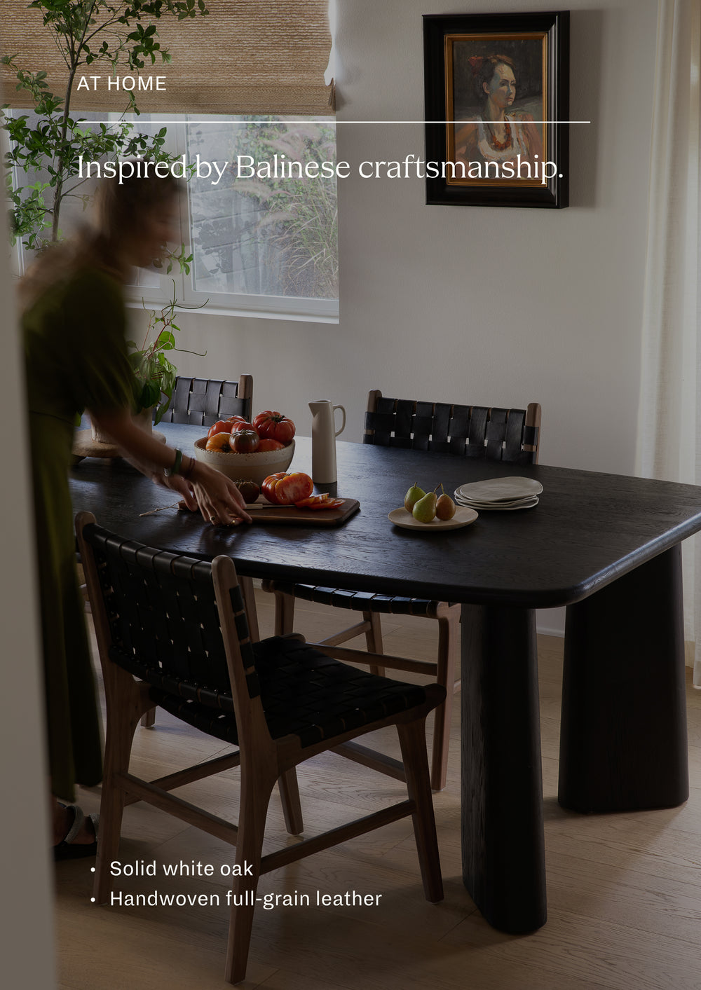 The Bali Dining Chair styled around a dark wood dining table, showcasing the striking contrast between woven black leather seating and warm oak frames. The look is grounded, modern, and timeless.