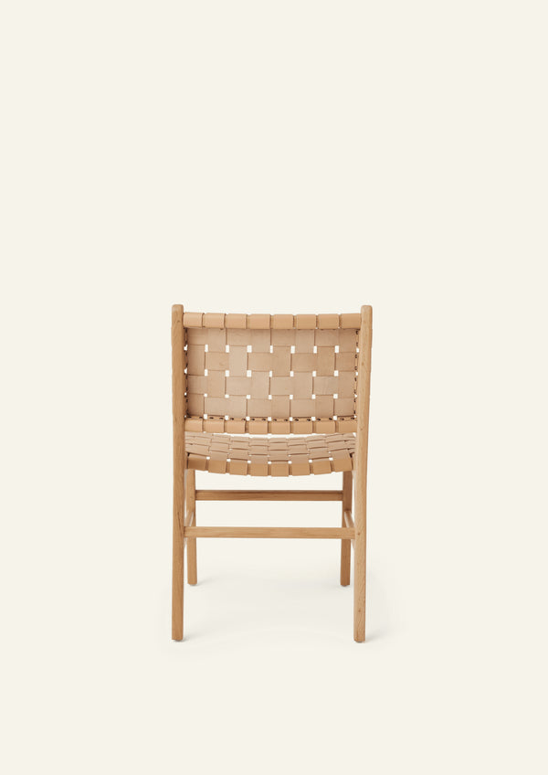 Rear view of the Bali Dining Chair showcasing the woven leather backrest and solid white oak frame. The handcrafted weave highlights the chair’s artisanal construction and natural materials.
