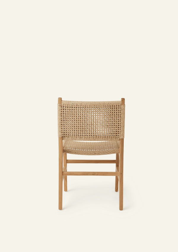 Rear view of the Bali Dining Chair showcasing the handwoven outdoor synthetic paper cord backrest and solid teak frame.