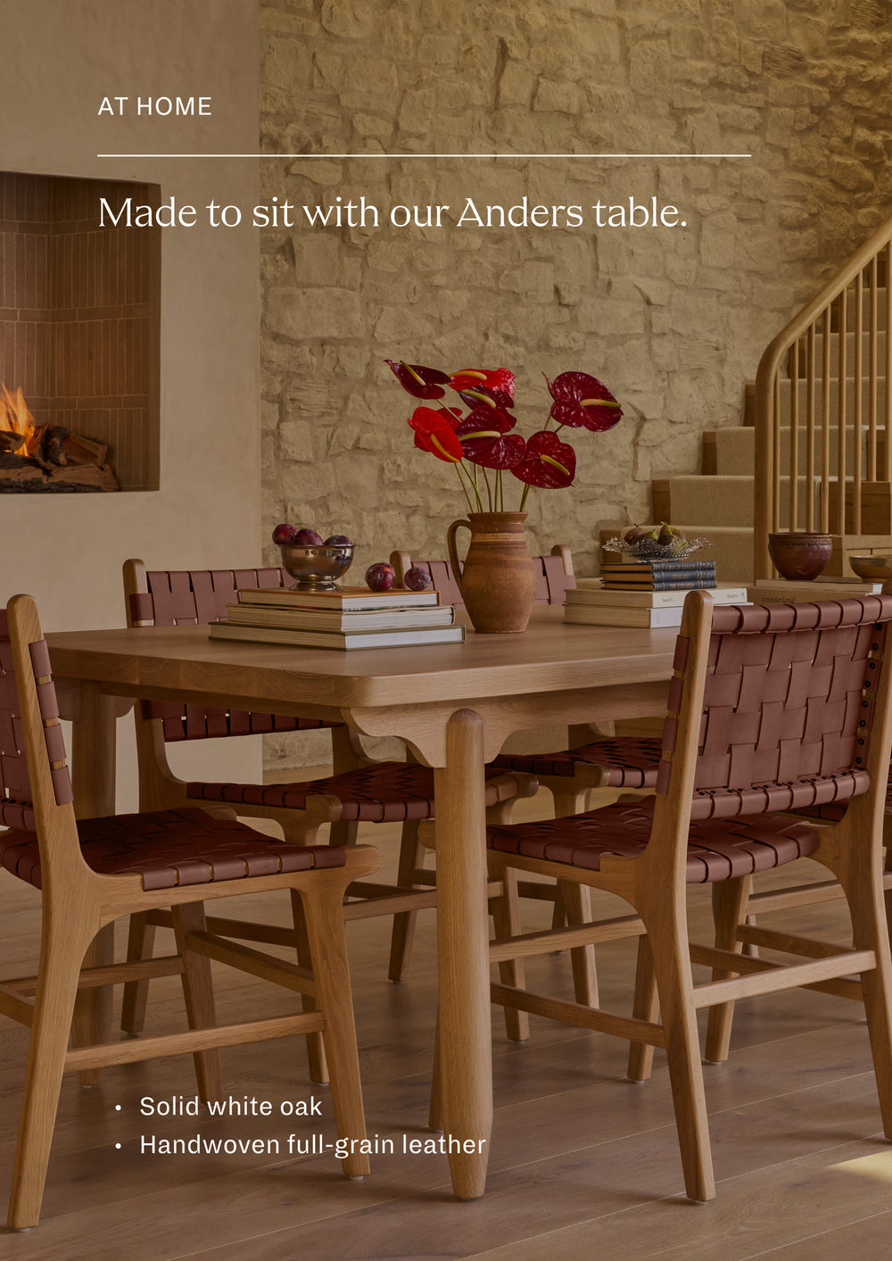 The Bali Dining Chair styled around the Anders Dining Table in a warm, layered dining room. The woven whiskey leather adds texture, warmth, and a collected feel to the space.