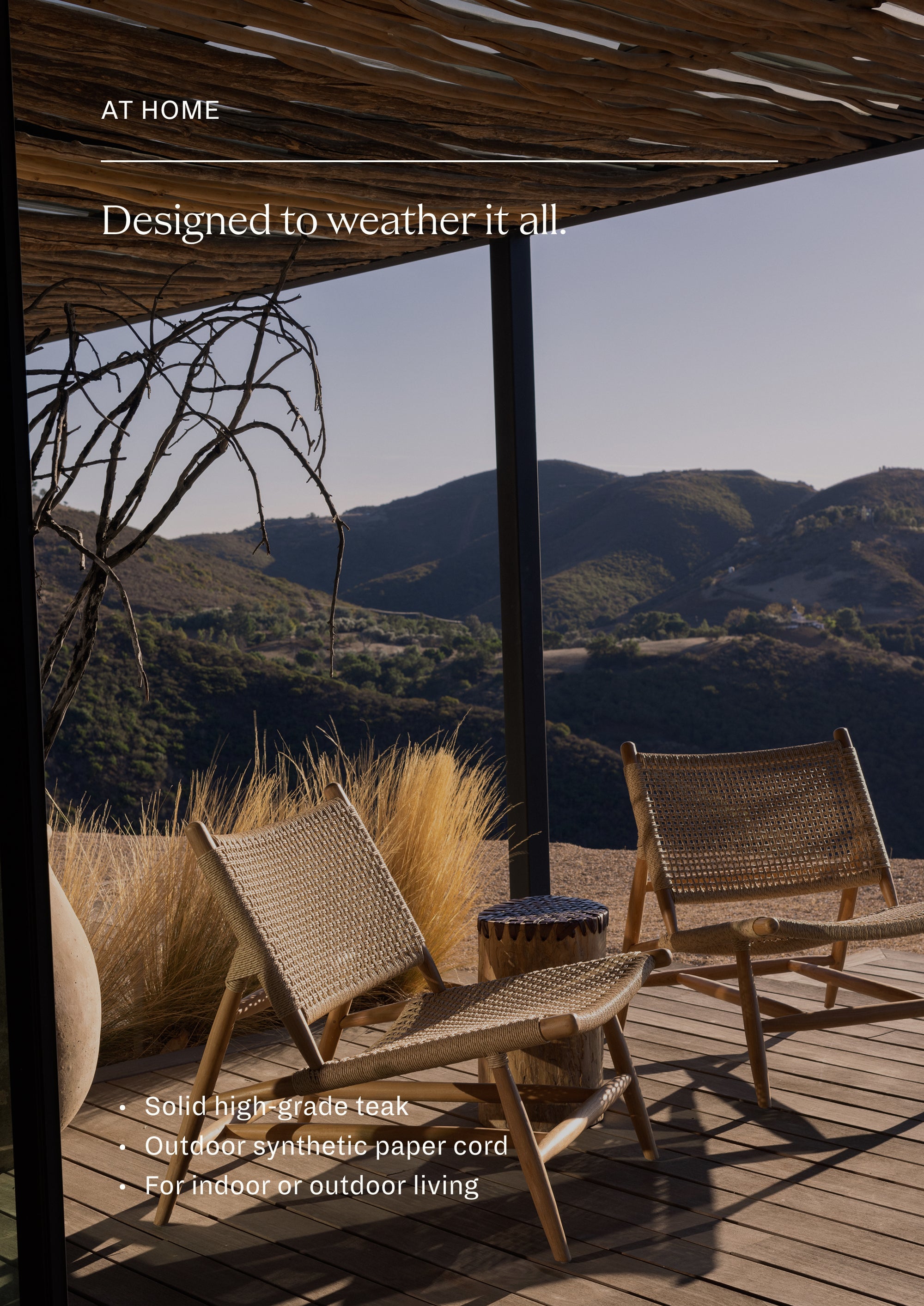 Pair of woven teak lounge chairs arranged outdoors around a small side table in a desert-inspired landscape. The collection creates a relaxed retreat for conversation, reading, or enjoying the outdoors.