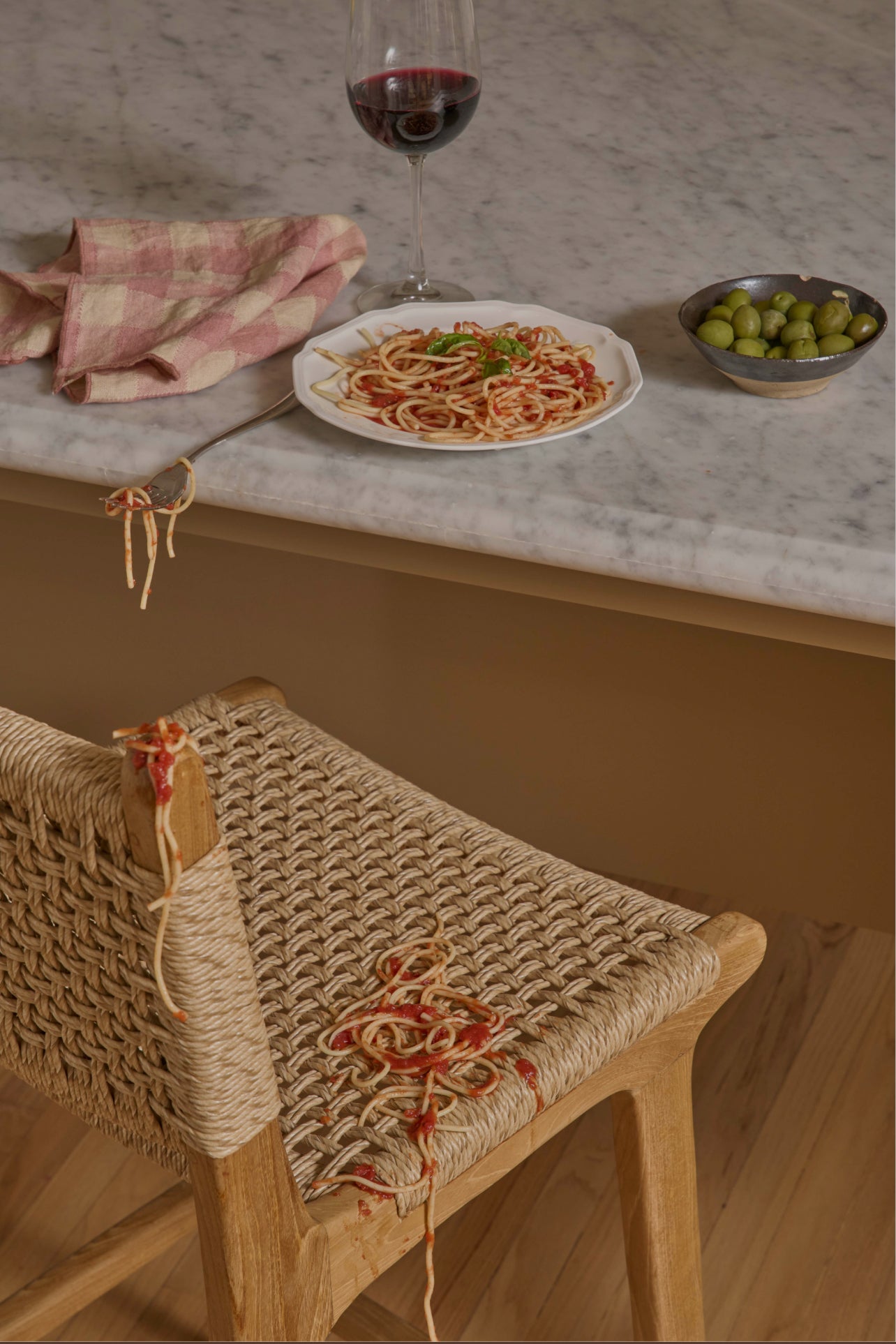 Bali counter stool with spilled spaghetti at kitchen counter