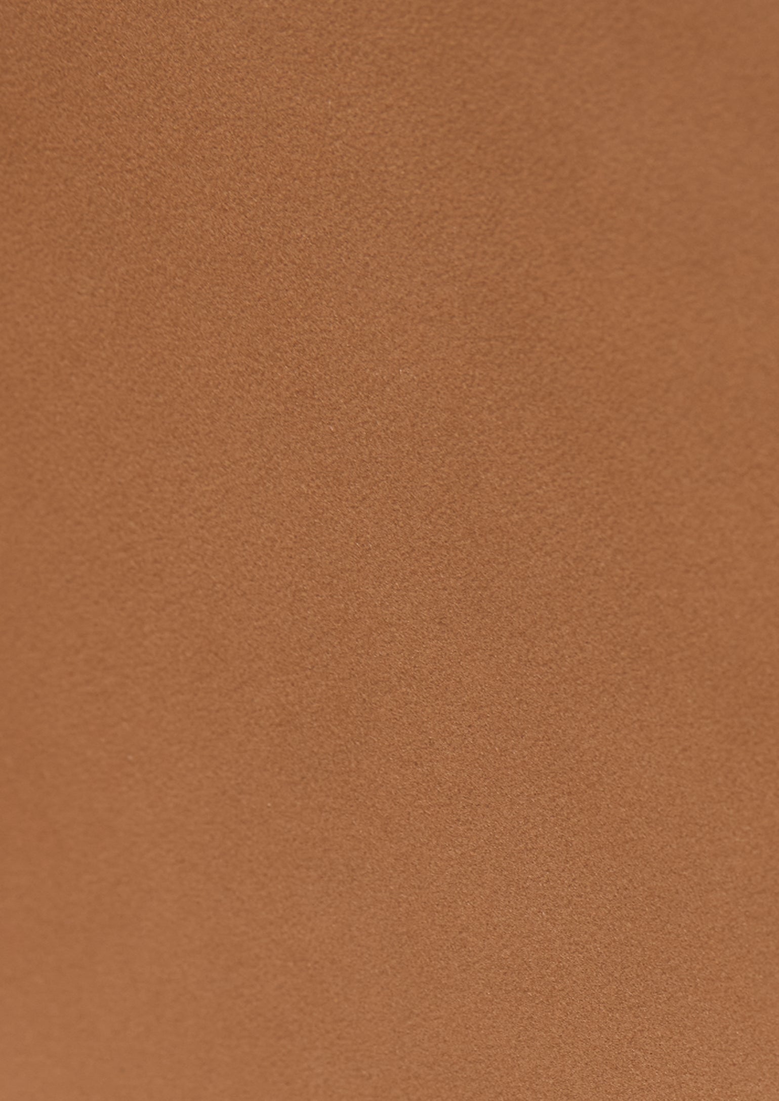 Solid warm brown leather swatch