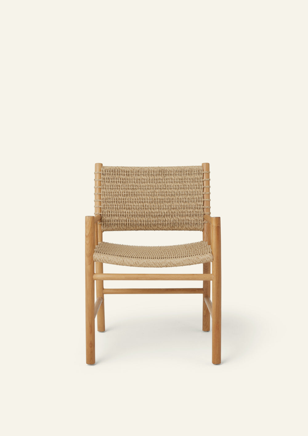 Front view of the dining armchair featuring a handwoven synthetic paper cord seat and backrest framed by solid teak. The balanced proportions and supportive armrests bring comfort and timeless style to any dining setting.