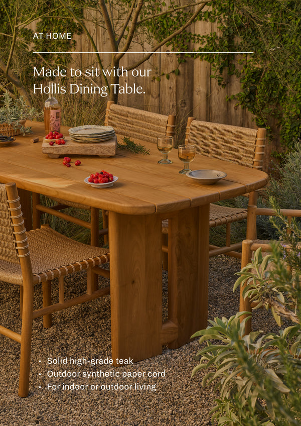Made to site with the Hollis Dining Table in Classic Teak. A set of woven dining chairs gathered around a reclaimed teak dining table in an outdoor garden setting. Natural materials and handcrafted details create an inviting space for open-air dining and entertaining.