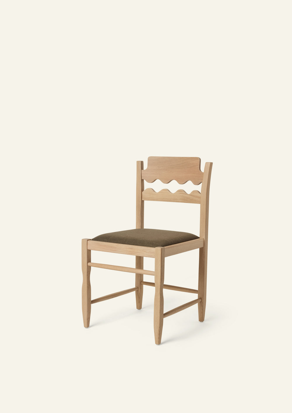 Freda Razor Dining Chair in natural oak with an upholstered performance olive linen seat, shown from an angled front view on a neutral background. The hand-carved scalloped backrest adds a playful yet timeless detail.