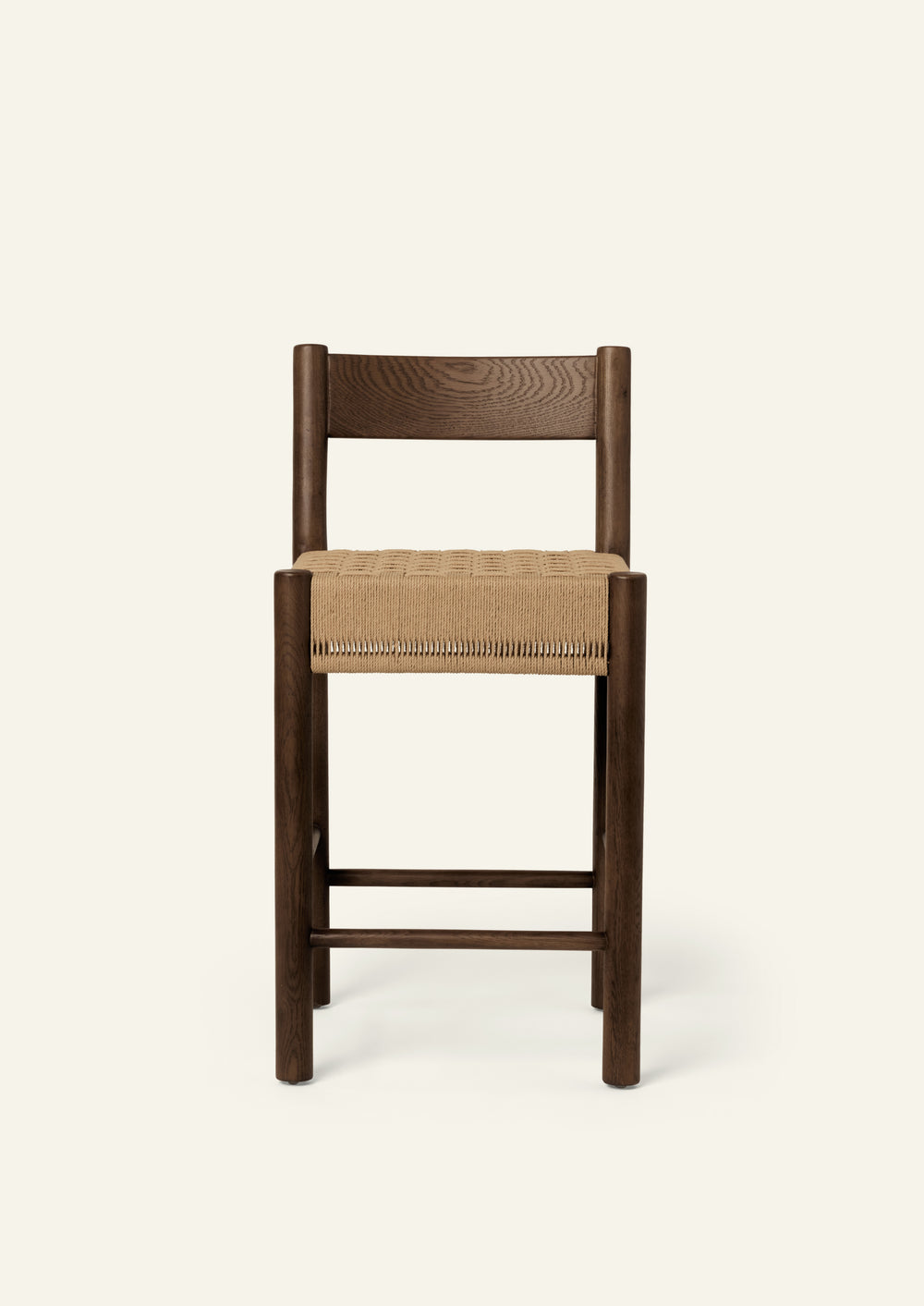 Front view of the Isa Counter Stool featuring a clean-lined silhouette, woven seat, and supportive backrest.