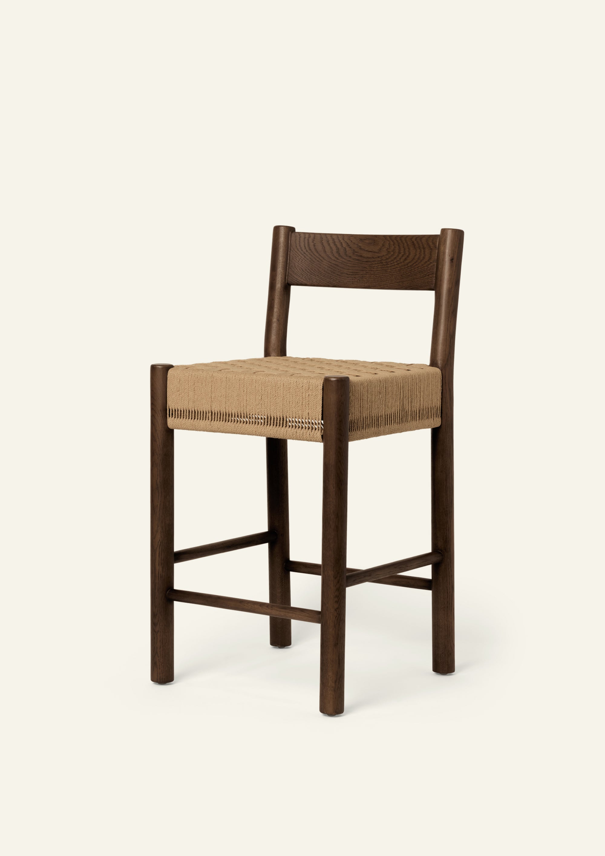 Isa Counter Stool crafted from solid brown oak with a handwoven paper cord seat, blending clean lines with timeless craftsmanship.