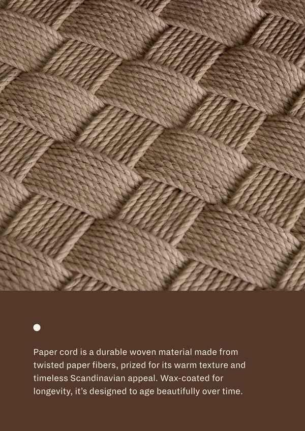 Paper cord seat: A durable woven material made from twisted paper fibers, prized for its warm texture and timeless Scandinavian appeal. Wax-coated for longevity, it's designed to age beautifully over time. 
