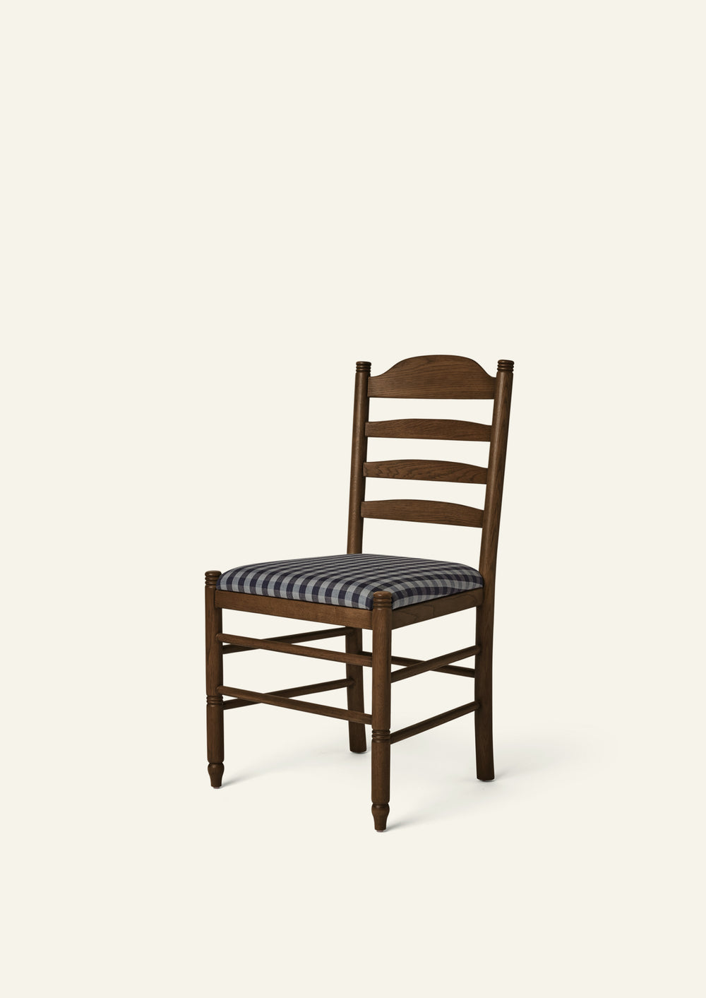 Lea Dining Chair in solid brown oak with a custom upholstered seat using material that can be shipped to the hati team, blending traditional ladder-back craftsmanship with timeless European character.