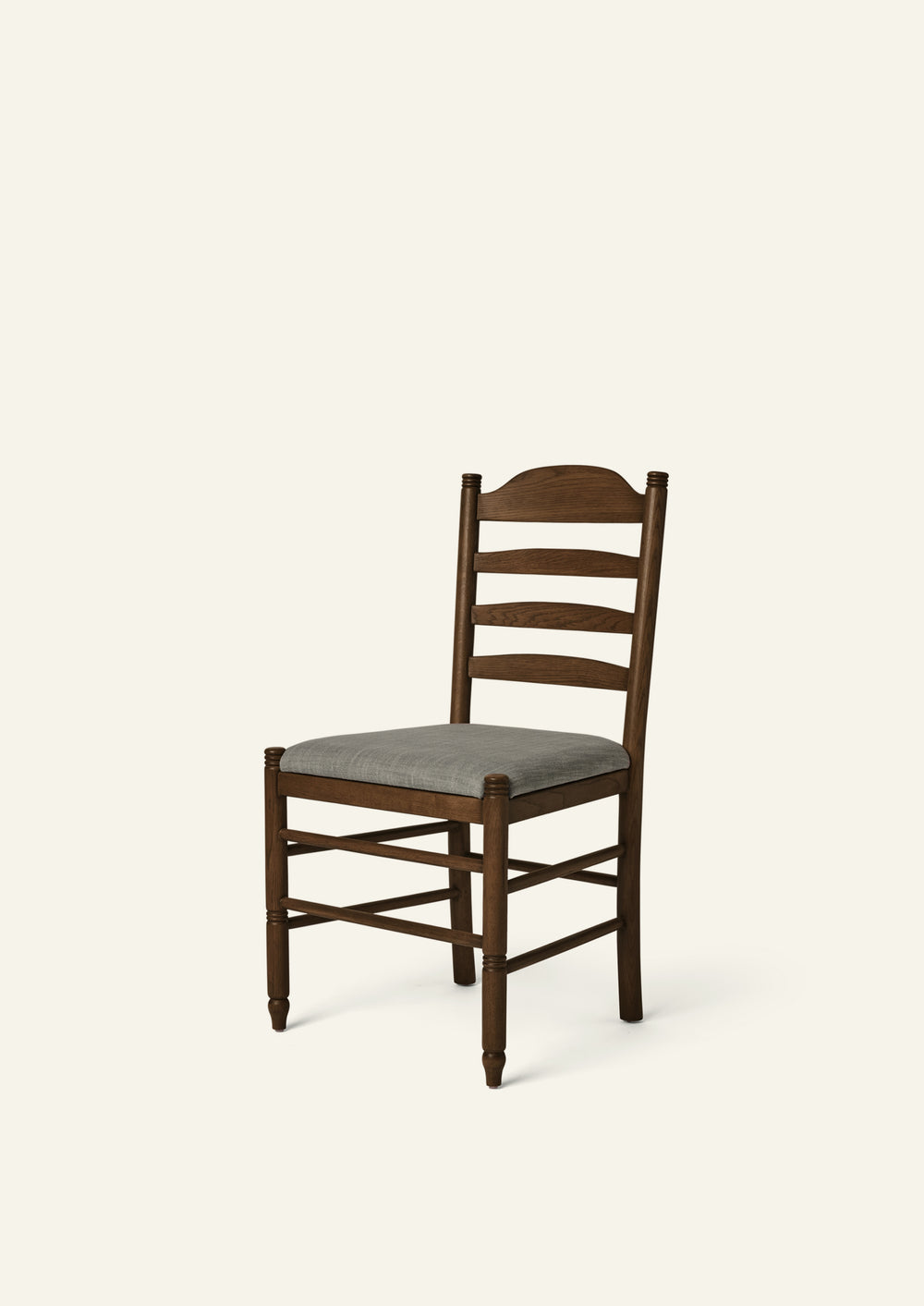 Lea Dining Chair in solid brown oak with a upholstered Slate performance linen, blending traditional ladder-back craftsmanship with timeless European character.