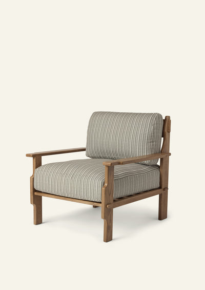 Lounge chair featuring green stripe upholstery and a solid honey oak frame. Plush seat and back cushions pair with architectural wood detailing for a relaxed yet refined silhouette.