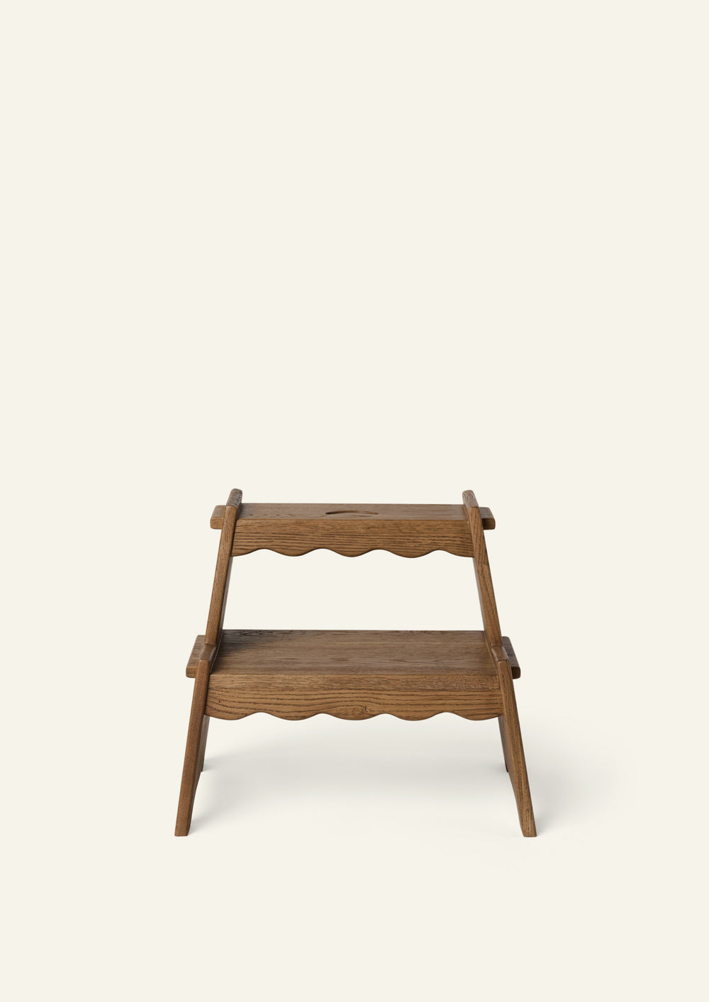 Front view of the Margot Step Stool showcasing its two-tier design, scalloped edges, and gently angled side supports. The balanced proportions offer both stability and visual charm.