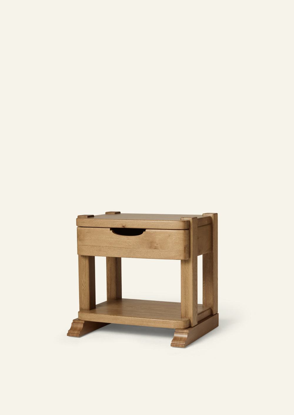 Vintage inspired honey oak nightstand featuring a single drawer, open lower shelf, and sculpted bracket feet. The solid oak construction, softened edges, and warm finish create a timeless, heirloom-inspired silhouette.
