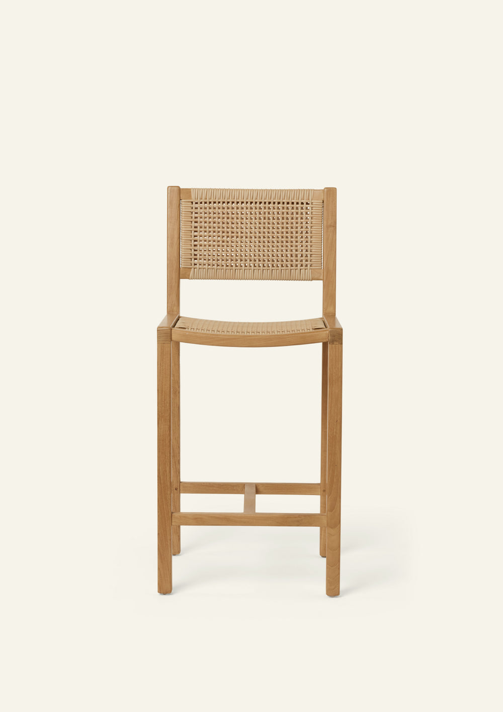 Front view of the Nusa Counter Stool highlighting its clean silhouette, synthetic woven rattan back, and balanced proportions.