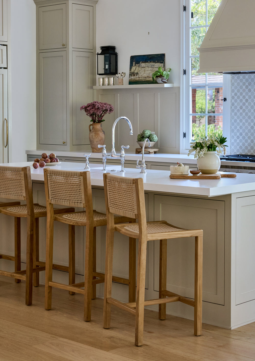 Nusa counter stool in a traditional kitchen with decor elements. 