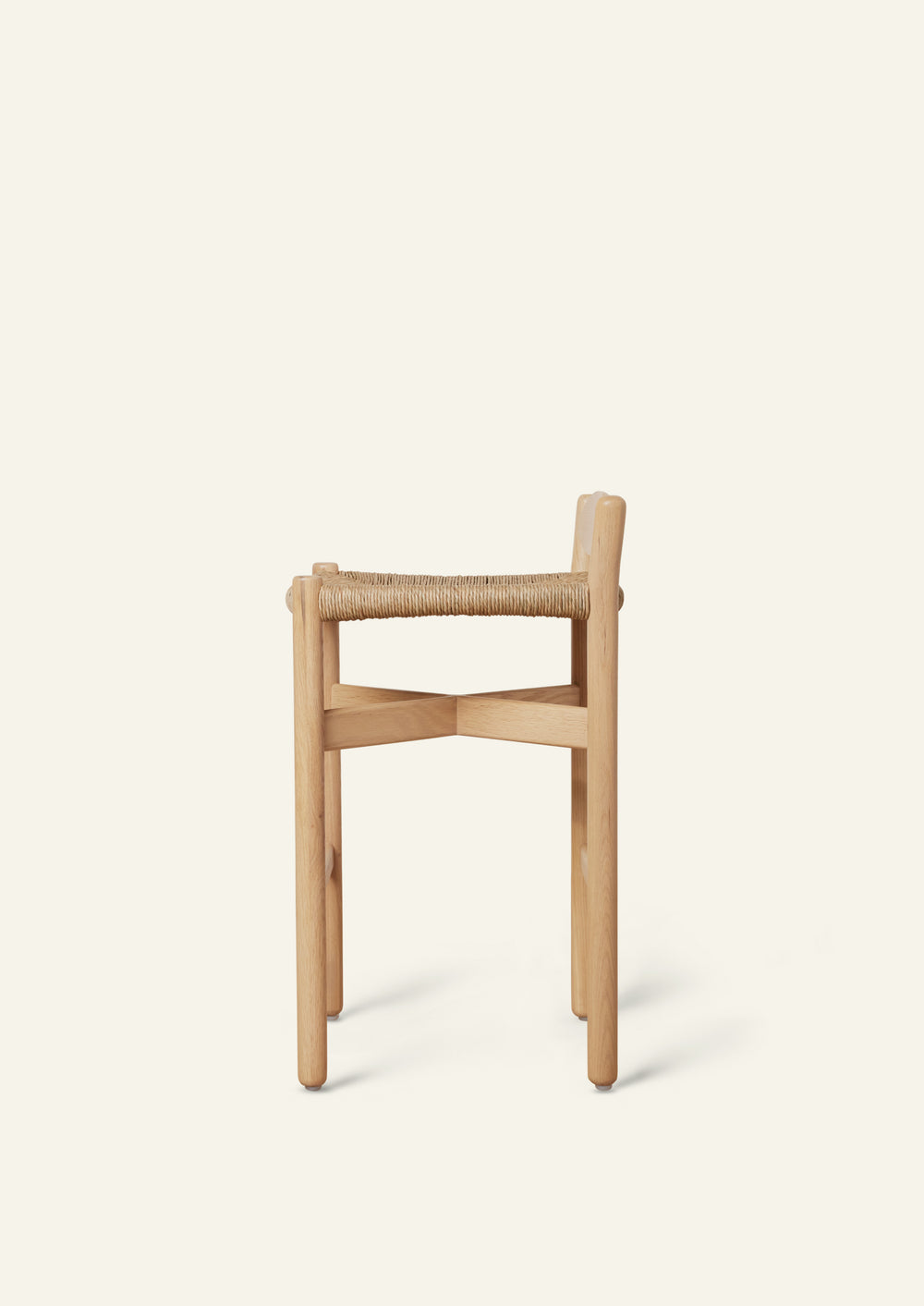Rear view of the Olma Counter Stool highlighting the gently curved backrest, woven natural rush seat, and solid white oak construction.