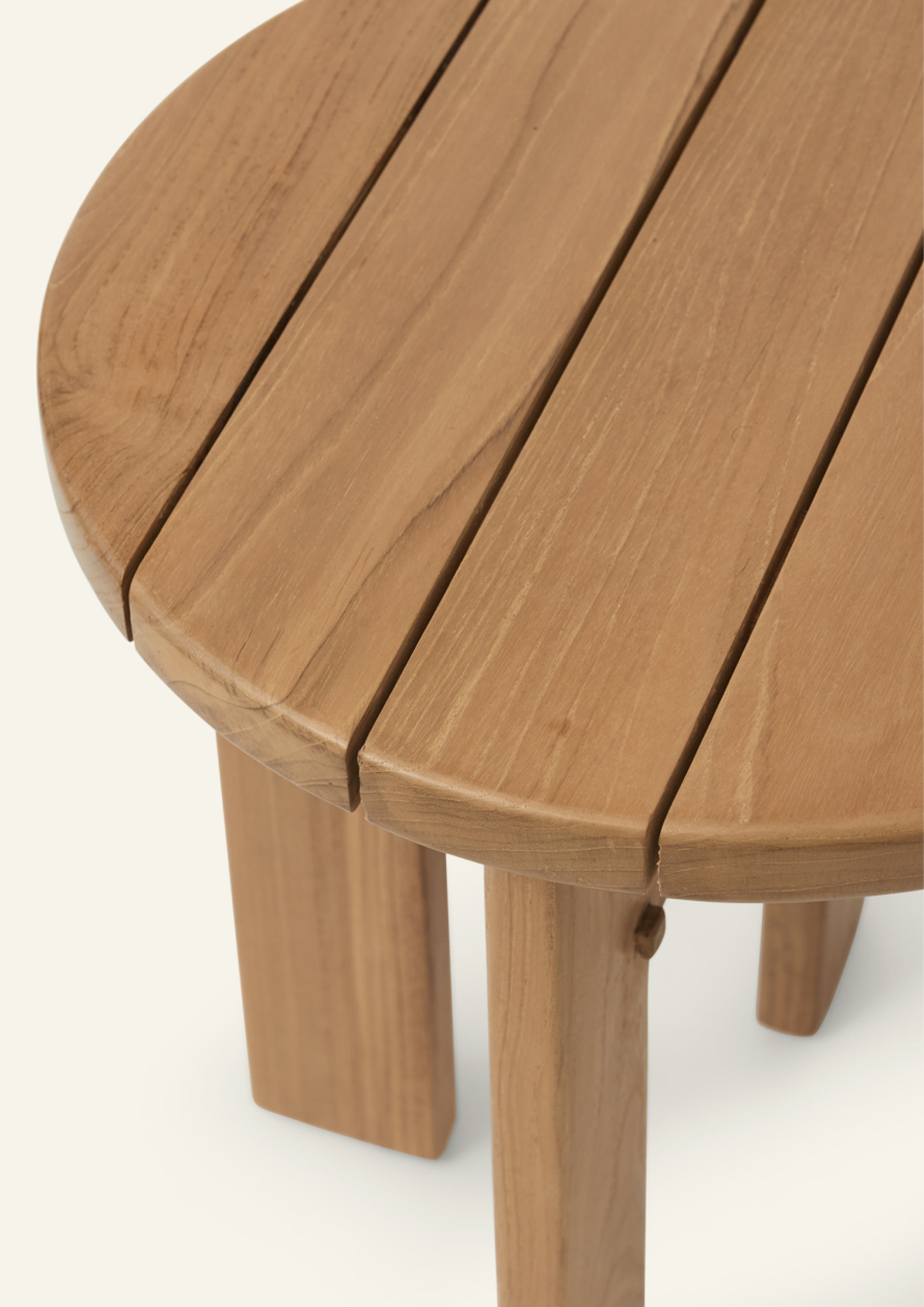 Close-up of the Otto Side Table tabletop featuring slatted teak construction and rounded edges