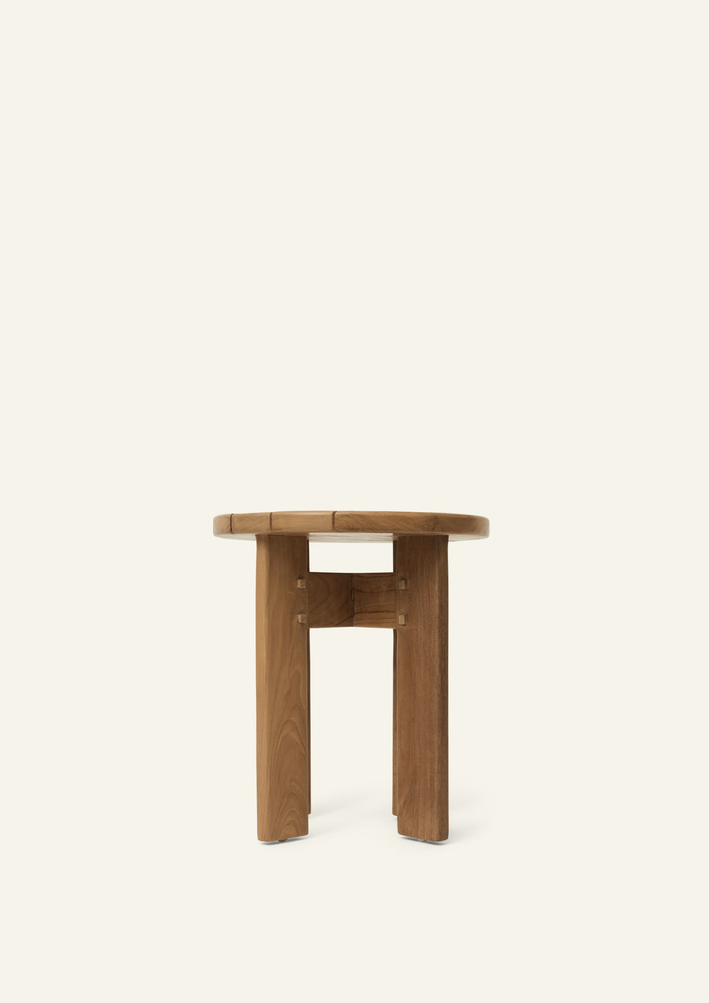 Rear view of the Otto Side Table highlighting its sculptural solid teak construction