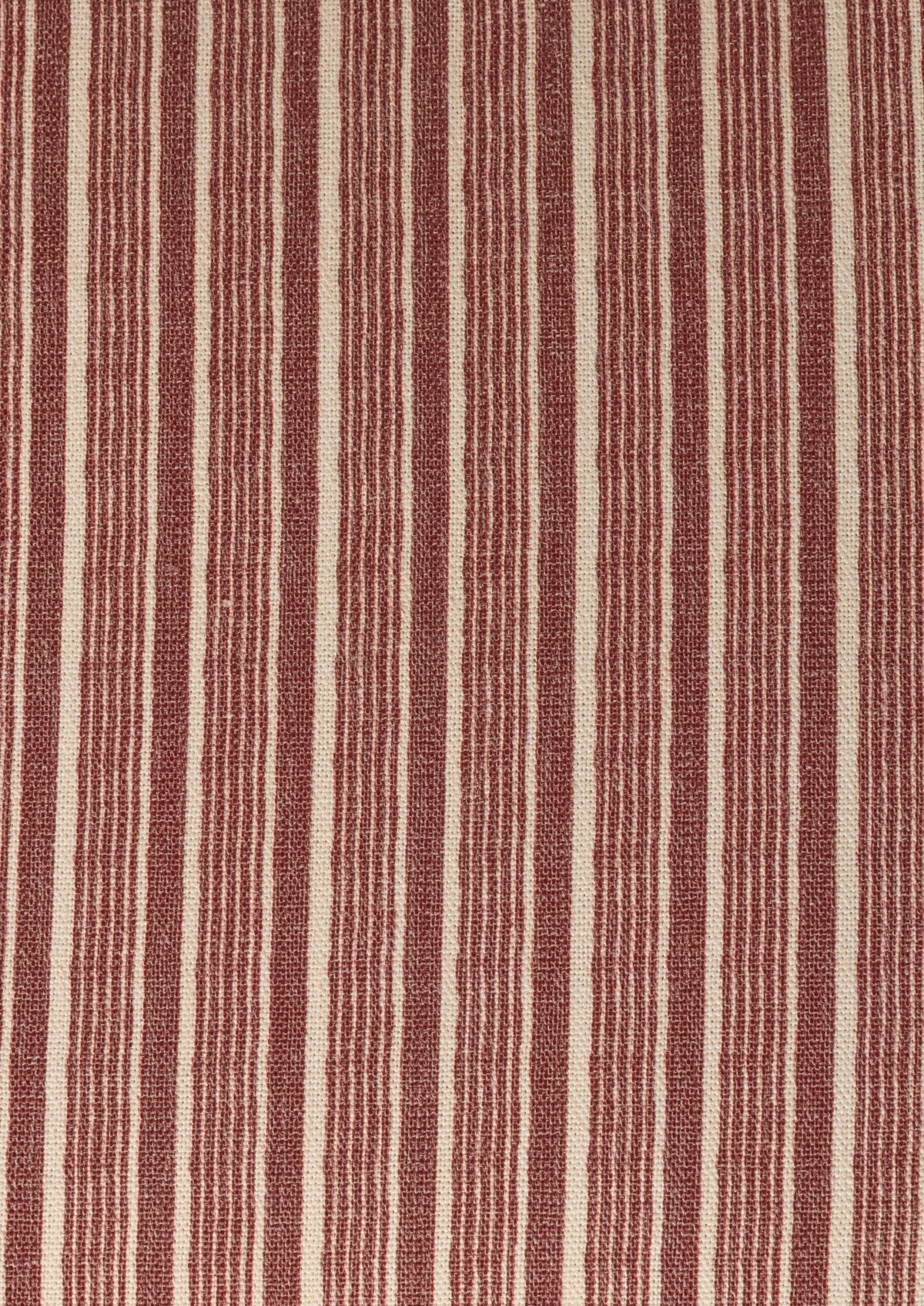 Organic brick red stripe pattern that alternates width of the stripes. 