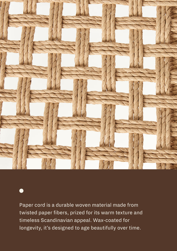 Close-up of woven paper cord showing the basket-weave pattern and natural texture. The material emphasizes warmth, durability, and handcrafted appeal.