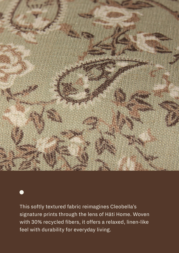 Close-up of the Aloe Botanical fabric, featuring delicate botanical motifs in soft sage, taupe, blush, and cream tones. Woven with recycled fibers, the textile offers a relaxed, linen-like texture designed for everyday durability and comfort.