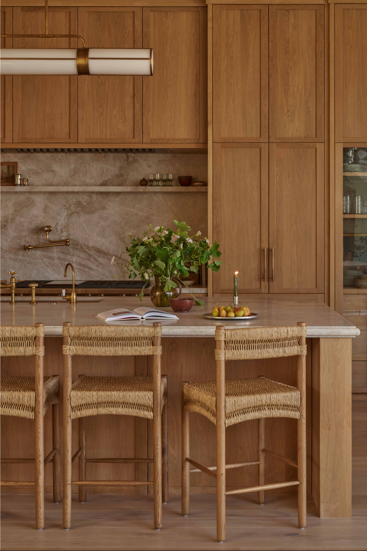 Rush and white oak counter stool in all wood kitchen