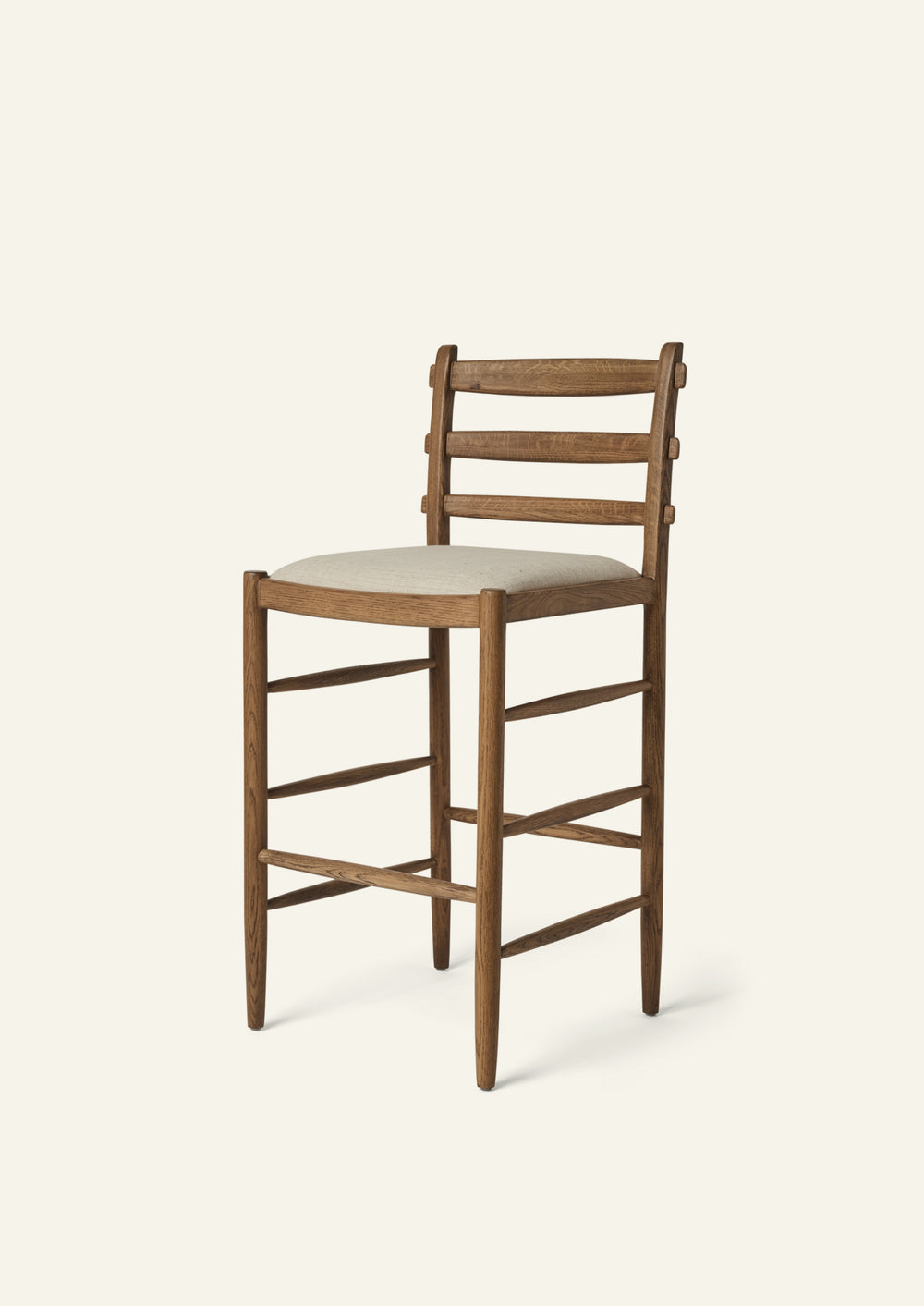 Tiga Counter Stool with a solid honey oak frame an upholstered performance sand linen seat, shown from an angled front view on a neutral background.
