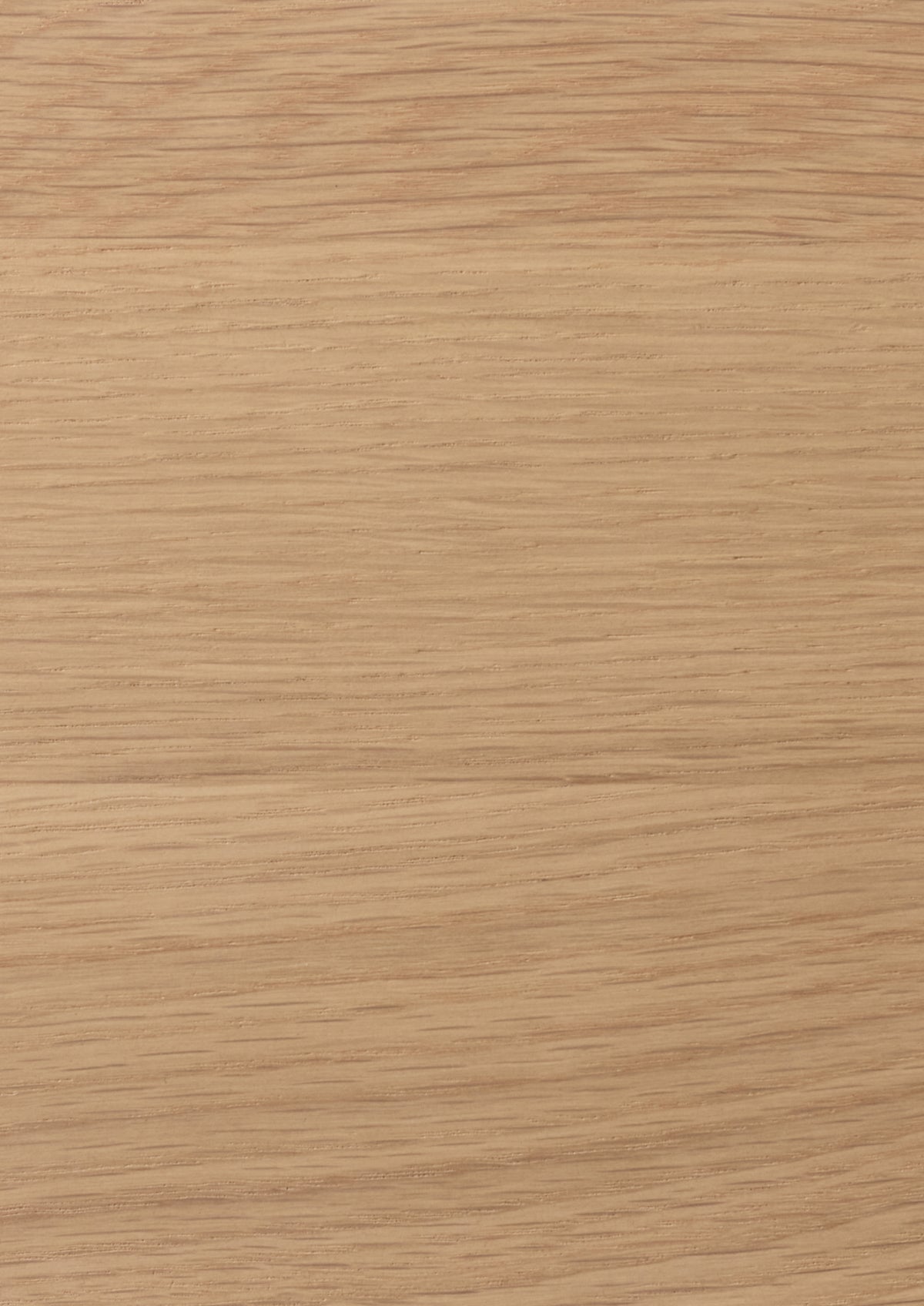 Close-up of a light oak surface with a light tan color and visible grain pattern.