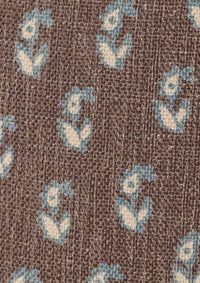 Close-up of the Cocoa Floral fabric by Cleobella. A cool brown base with individual paisleys in ivory with a blue outline.