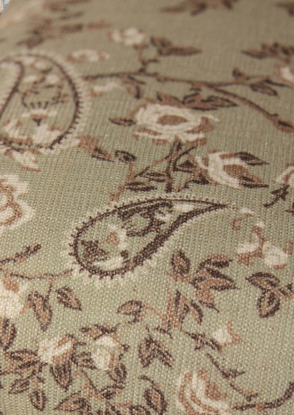 Ivory, tan and brown paisley fabric on a muted green base. 